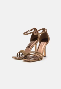 Menbur Sandalen Met Hoge Hak - Bronze -Damesschoenen b32864f7539e4d22b0d785cd86cc6087 scaled